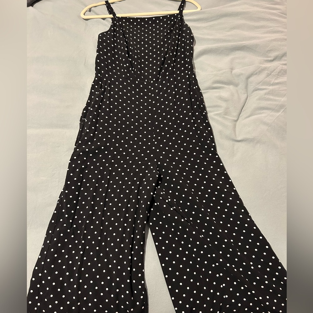 Black and white polka dot wide leg jumpsuit with adjustable straps